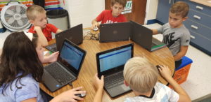 Students working on their laptops